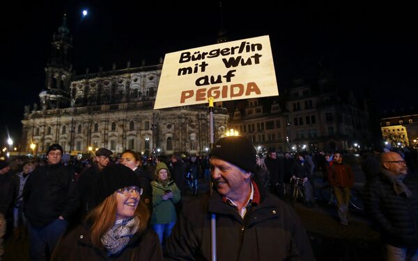 Opponents of the anti-immigration right-wing movement PEGIDA (Patriotic Europeans Against the Islamisation of the West) gather in Dresden, Germany Opponents of the anti-immigration right-wing movement PEGIDA (Patriotic Europeans Against the Islamisation of the West) gather in Dresden, Germany - Sputnik International