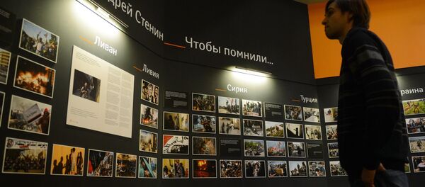 Photographic exhibition of MIA Rossiya Segodnya news agency photo correspondent Andrei Stenin killed in Ukraine on professional duty. - Sputnik International