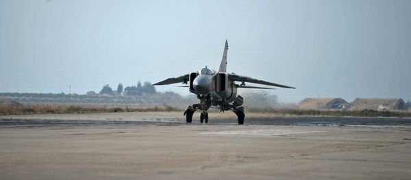 A MiG-23 aircraft of the Syrian Air Force on a runaway at the Hama airbase near the city of Hama, Syria's Hama Province - Sputnik International