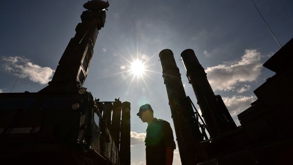 A serviceman stands near an S-300 surface-to-air missile system. (File) - Sputnik International