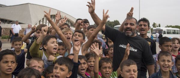 Refugees kids shout Thank you, Putin! while posing for journalists at a camp in Latakia, Syria, Friday, Oct. 23, 2015 Refugees kids shout Thank you, Putin! while posing for journalists at a camp in Latakia, Syria, Friday, Oct. 23, 2015 - Sputnik International