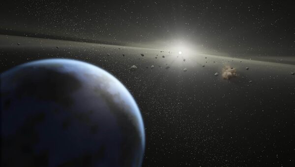 This artist's rendition released 20 April, 2005 by NASA shows a massive asteroid belt in orbit around a star the same age and size as our Sun - Sputnik International
