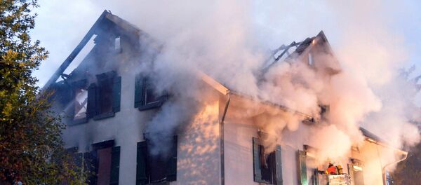 Smoke billows from a burning house that was planned to be converted into a shelter for asylum seekers in Weissach, southern Germany (File) Smoke billows from a burning house that was planned to be converted into a shelter for asylum seekers in Weissach, southern Germany (File) - Sputnik International