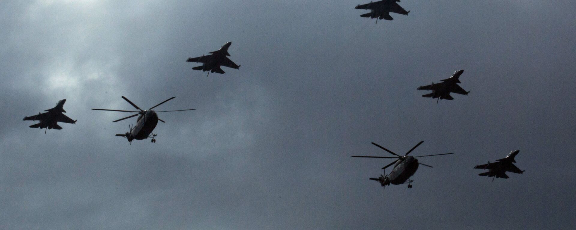 In this Aug. 23, 2015 file photo, Chinese Mi-8 military helicopters and J-16 fighter jets fly over central Beijing during a rehearsal for a large military parade. - Sputnik International, 1920, 03.10.2021