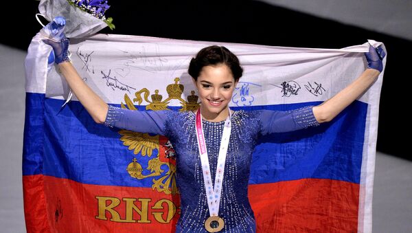 Russia's Yevgeniya Medvedeva, winner of the gold medal in the women's free program competition at the ISU Grand Prix of Figure Skating Final in Barcelona, during the medal ceremony - Sputnik International
