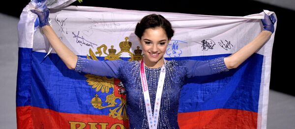 Russia's Yevgeniya Medvedeva, winner of the gold medal in the women's free program competition at the ISU Grand Prix of Figure Skating Final in Barcelona, during the medal ceremony Russia's Yevgeniya Medvedeva, winner of the gold medal in the women's free program competition at the ISU Grand Prix of Figure Skating Final in Barcelona, during the medal ceremony - Sputnik International