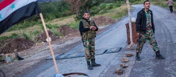 Syrian soldiers at a check point not far from Kesab, seized by Islamists, on the border with Turkey and the Latakiyah province (File) Syrian soldiers at a check point not far from Kesab, seized by Islamists, on the border with Turkey and the Latakiyah province (File) - Sputnik International