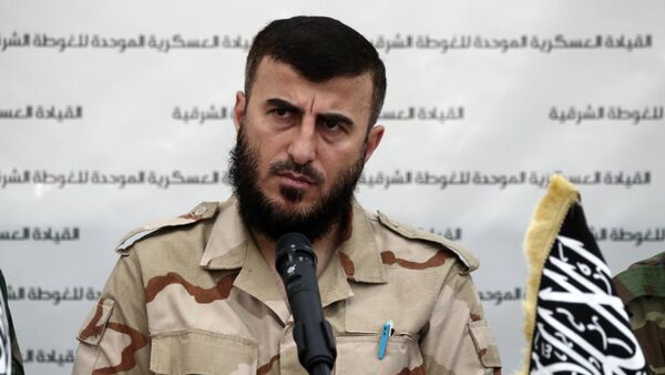 Zahran Alloush, the leader of Jaysh al-Islam (Islam Army) and military leader of the Islamic Front, attends a press conference with other brigade leaders in the rebel-held Eastern Ghouta region outside the capital Damascus on August 27, 2014, to announce the fomation of The Unified Military Command of Eastern Ghouta - Sputnik International
