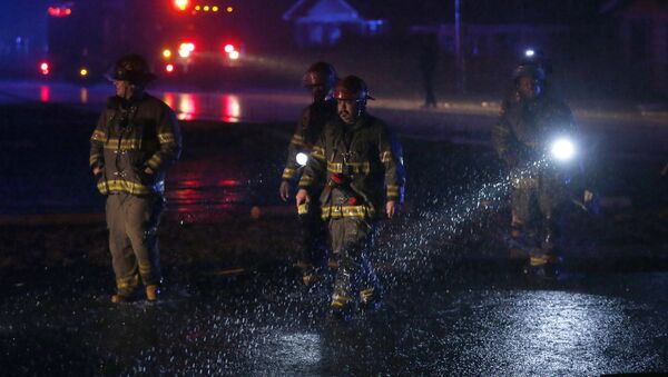 Birmingham firefighters work a scene after a tornado touched down in Jefferson County, Ala., damaging several houses, Friday, Dec. 25, 2015. - Sputnik International