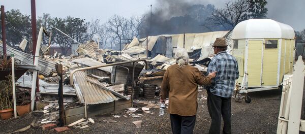 Property owners inspect their house that was destroyed by a bushfire near the town of Roseworthy, located north of Adelaide, South Australia, November 25, 2015 Property owners inspect their house that was destroyed by a bushfire near the town of Roseworthy, located north of Adelaide, South Australia, November 25, 2015 - Sputnik International