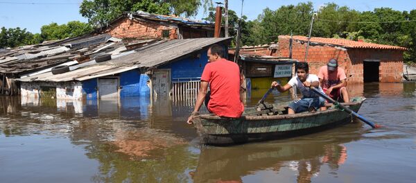 Locals on boats in a flooded neighbourhood in Asuncion on December 20, 2015 Locals on boats in a flooded neighbourhood in Asuncion on December 20, 2015 - Sputnik International