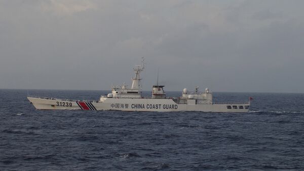 China Coast Guard vessel No. 31239 sails in the East China Sea near the disputed isles known as Senkaku isles in Japan and Diaoyu islands in China, in this handout photo taken and released by the 11th Regional Coast Guard Headquarters-Japan Coast Guard December 22, 2015 - Sputnik International