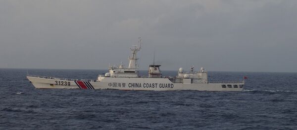 China Coast Guard vessel No. 31239 sails in the East China Sea near the disputed isles known as Senkaku isles in Japan and Diaoyu islands in China, in this handout photo taken and released by the 11th Regional Coast Guard Headquarters-Japan Coast Guard December 22, 2015 - Sputnik International