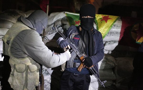 The militants of the Kurdistan Workers' Party, or PKK, stand at a barricade in Sirnak, Turkey, late Wednesday, Dec. 23, 2015. - Sputnik International