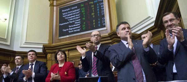 Ukraine's Prime Minister Arseny Yatseniuk (3rd R), Finance Minister Natalia Yaresko (4th R), Interior Minister Arsen Avakov (2nd R) and other ministers react after parliament approved the budget during a session in Kiev, Ukraine, December 25, 2015 Ukraine's Prime Minister Arseny Yatseniuk (3rd R), Finance Minister Natalia Yaresko (4th R), Interior Minister Arsen Avakov (2nd R) and other ministers react after parliament approved the budget during a session in Kiev, Ukraine, December 25, 2015 - Sputnik International