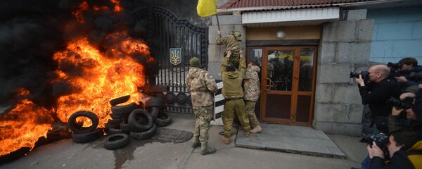 Fighters of Aidar Battalion try to storm the gate of the building of the Ukraine Ministry of Defence in Kiev during their protest action Fighters of Aidar Battalion try to storm the gate of the building of the Ukraine Ministry of Defence in Kiev during their protest action - Sputnik International