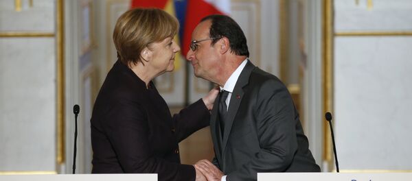French president Francois Hollande, right, kisses German Chancellor Angela Merkel at the end of a joint press conference at the Elysee Palace, in Paris, Wednesday, Nov. 25, 2015 French president Francois Hollande, right, kisses German Chancellor Angela Merkel at the end of a joint press conference at the Elysee Palace, in Paris, Wednesday, Nov. 25, 2015 - Sputnik International