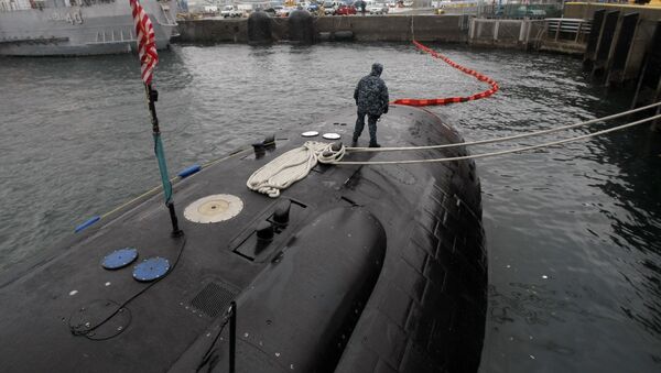 Crew member patrols on the USS Charlotte, a nuclear powered attack submarine, at the Yokosuka Naval Base, south of Tokyo. (File) - Sputnik International