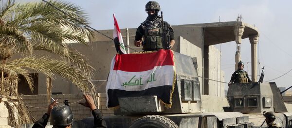 Iraqi security forces surround the government complex in central Ramadi, 70 miles (115 kilometers) west of Baghdad, Iraq, Monday, Dec. 28, 2015. Iraqi security forces surround the government complex in central Ramadi, 70 miles (115 kilometers) west of Baghdad, Iraq, Monday, Dec. 28, 2015. - Sputnik International