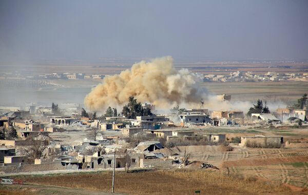 Smoke rises from buildings in the area of Tal Sharba following government air strikes on the outskirts of the northern Syrian city of Aleppo on December 27, 2015, as government forces seized the area from Islamic State (IS) group jihadists Smoke rises from buildings in the area of Tal Sharba following government air strikes on the outskirts of the northern Syrian city of Aleppo on December 27, 2015, as government forces seized the area from Islamic State (IS) group jihadists - Sputnik International