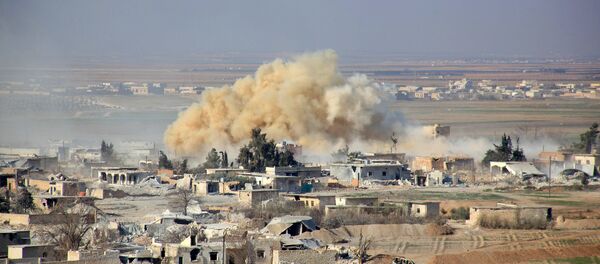 Smoke rises from buildings in the area of Tal Sharba following government air strikes on the outskirts of the northern Syrian city of Aleppo on December 27, 2015, as government forces seized the area from Islamic State (IS) group jihadists Smoke rises from buildings in the area of Tal Sharba following government air strikes on the outskirts of the northern Syrian city of Aleppo on December 27, 2015, as government forces seized the area from Islamic State (IS) group jihadists - Sputnik International
