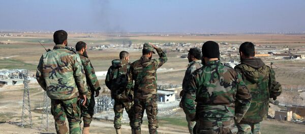 Syrian pro-government fighters look at smoke rising on the horizon following government air strikes on the Tal Sharba area, on the outskirts of the northern Syrian city of Aleppo, after they seized the area from Islamic State (IS) group jihadists on December 27, 2015 Syrian pro-government fighters look at smoke rising on the horizon following government air strikes on the Tal Sharba area, on the outskirts of the northern Syrian city of Aleppo, after they seized the area from Islamic State (IS) group jihadists on December 27, 2015 - Sputnik International