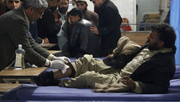 A man, who sustained injuries in a suicide attack at a government office, receives first aid at the Lady Reading Hospital in Peshawar, Pakistan, December 29, 2015 - Sputnik International