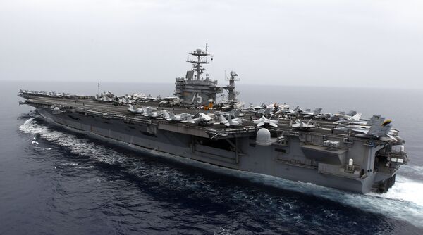A general view shows the nuclear-powered aircraft carrier USS Harry S. Truman at an undisclosed position in the Mediterranean Sea, south of Sicily, Monday June 14, 2010 - Sputnik International