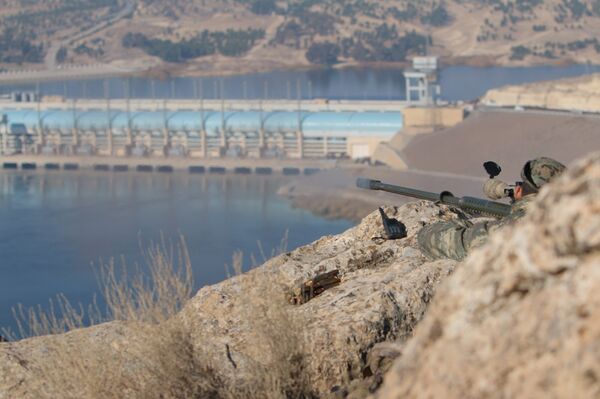 A sniper from the Democratic Forces of Syria takes an overwatch position at the top of Mount Annan overlooking the Tishrin dam, after they captured it on Saturday from Islamic State militants, south of Kobani, Syria December 27, 2015 A sniper from the Democratic Forces of Syria takes an overwatch position at the top of Mount Annan overlooking the Tishrin dam, after they captured it on Saturday from Islamic State militants, south of Kobani, Syria December 27, 2015 - Sputnik International
