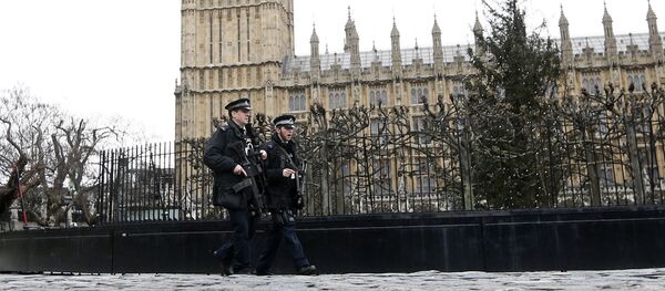 Armed police are seen on patrol at The Houses of Parliament in London, England Armed police are seen on patrol at The Houses of Parliament in London, England - Sputnik International