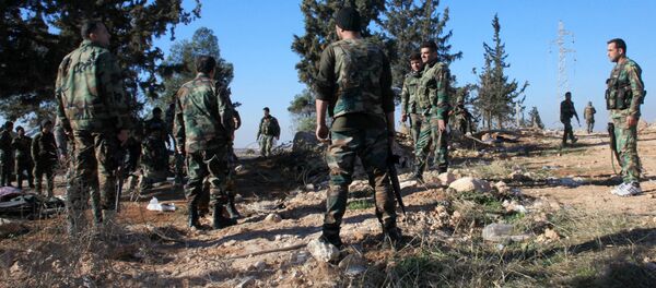 Syrian government forces inspect an area near the village of Khan Tuman, south from the provincial capital Aleppo, on December 22, 2015 Syrian government forces inspect an area near the village of Khan Tuman, south from the provincial capital Aleppo, on December 22, 2015 - Sputnik International