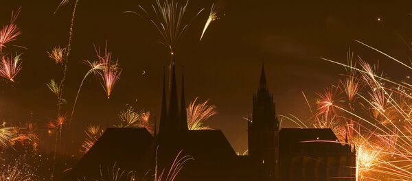 In this photo taken with long exposure, fireworks explode near the medieval Mariendom or St. Mary's Cathedral, right, and St. Severi's Church shortly after midnight during the New Year celebrations in Erfurt, central Germany, Friday, Jan. 1, 2016 In this photo taken with long exposure, fireworks explode near the medieval Mariendom or St. Mary's Cathedral, right, and St. Severi's Church shortly after midnight during the New Year celebrations in Erfurt, central Germany, Friday, Jan. 1, 2016 - Sputnik International