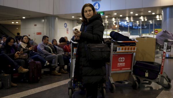 Ursula Gauthier, a reporter for the French current affairs magazine L'Obs, waits at Beijing international airport before her departure to France, in Beijing December 31, 2015 - Sputnik International