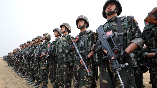 In this photograph taken on November 24, 2011 Chinese People's Liberation Army (PLA) soldiers take part in the Pakistan-China anti-terrorist drill as they wrap up their two-week military exercise in Jhelum, 85 kilometres southeast of Islamabad - Sputnik International
