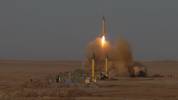 In this picture released by the Iranian Fars News Agency, asurface-to-surface missile is launched during the Iranian Revolutionary Guards maneuver in an undisclosed location in Iran, Tuesday, July 3, 2012 - Sputnik International