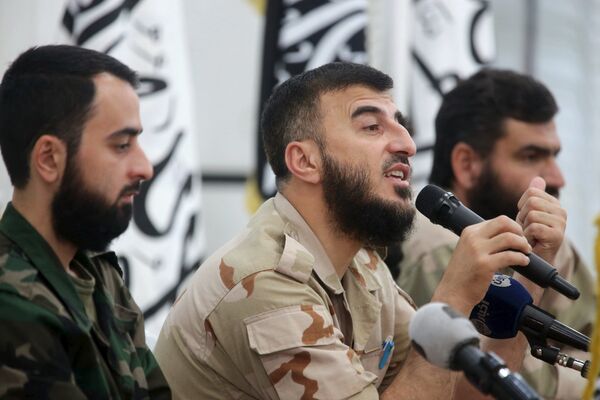 Zahran Alloush (C), commander of Jaysh al Islam, talks during a conference in the town of Douma, eastern Ghouta in Damascus, Syria August 27, 2014 Zahran Alloush (C), commander of Jaysh al Islam, talks during a conference in the town of Douma, eastern Ghouta in Damascus, Syria August 27, 2014 - Sputnik International