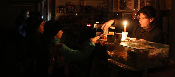 Shoppers pay for their purchases in a store during a power outage. File photo Shoppers pay for their purchases in a store during a power outage. File photo - Sputnik International
