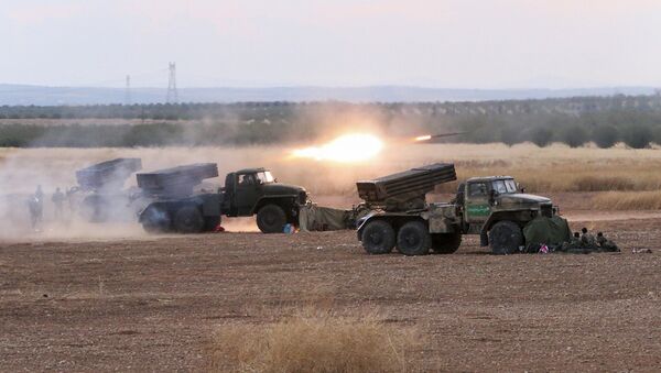 In this photo taken on Wednesday, Oct. 7, 2015, Syrian army rocket launchers fire near the village of Morek in Syria - Sputnik International