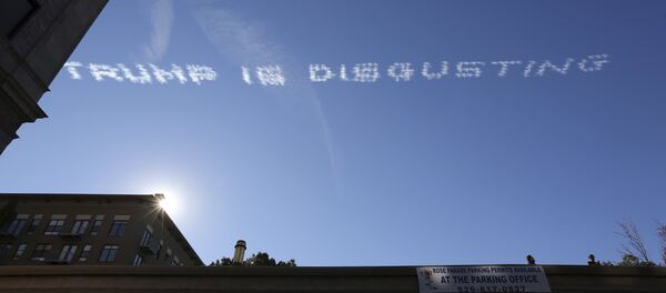 Skywriting over the 127th Rose Parade makes a reference to U.S. Republican presidential candidate Donald Trump, in Pasadena, California January 1, 2016 Skywriting over the 127th Rose Parade makes a reference to U.S. Republican presidential candidate Donald Trump, in Pasadena, California January 1, 2016 - Sputnik International