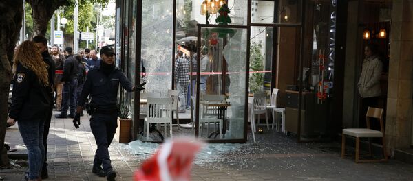 Members of the Israeli security forces cordon off the area following an attack by an unidentified gunman, who opened fire at a pub in the Israeli city of Tel Aviv killing two people and wounding five others on January 1, 2016, police and medical officials said Members of the Israeli security forces cordon off the area following an attack by an unidentified gunman, who opened fire at a pub in the Israeli city of Tel Aviv killing two people and wounding five others on January 1, 2016, police and medical officials said - Sputnik International