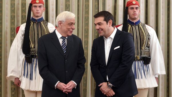 Greek Prime Minister Alexis Tsipras (R) chats with Greek President Prokopis Pavlopoulos as they attend the swearing-in ceremony of the new government at the presidential palace in Athens on September 23, 2015 - Sputnik International