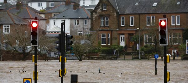 A flooded street is pictured in Dumfries, Scotland December 30, 2015 A flooded street is pictured in Dumfries, Scotland December 30, 2015 - Sputnik International