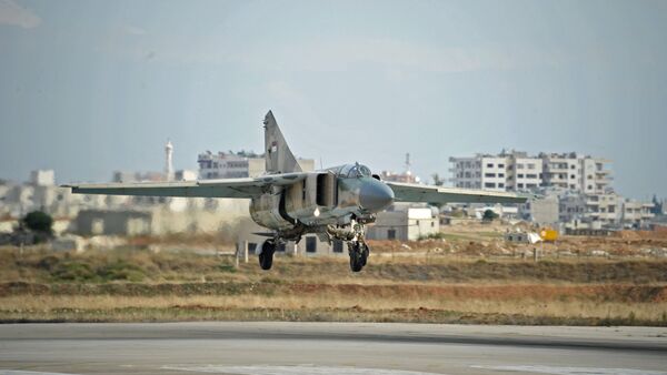A MiG-23 aircraft of the Syrian Air Force lands at the Hama airbase , Syria's Hama Province - Sputnik International
