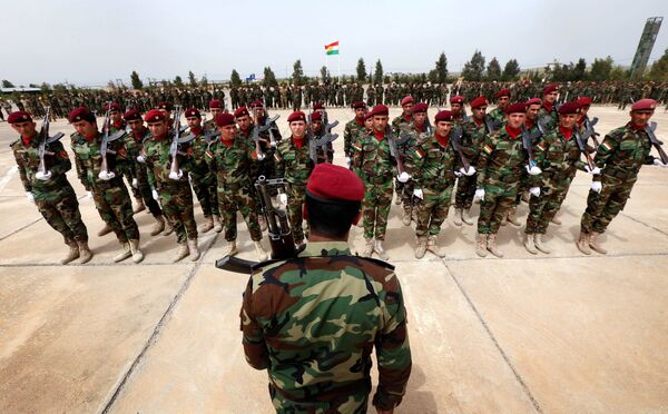 Kurdish Peshmerga fighters take part in a graduation ceremony on April 16, 2015 at the Kurdistan Training Coordination Center (KTTC) of Arbil, the capital of the autonomous Kurdish region of northern Iraq. Kurdish Peshmerga fighters take part in a graduation ceremony on April 16, 2015 at the Kurdistan Training Coordination Center (KTTC) of Arbil, the capital of the autonomous Kurdish region of northern Iraq. - Sputnik International