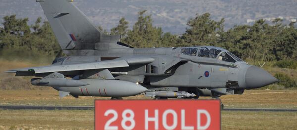British tornado warplane passes on the runway at the RAF Akrotiri, a British air base near costal city of Limassol, Cyprus, Thursday, Dec. 3, 2015 after an airstrike. British warplanes carried out airstrikes in Syria early Thursday, hours after Parliament voted to authorize air attacks against Islamic State group targets there - Sputnik International