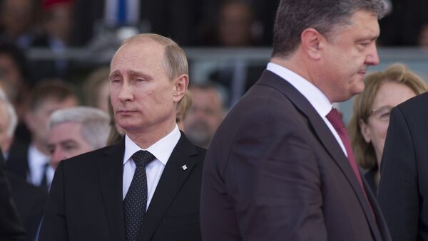 June 6, 2014. President Vladimir Putin (left) and Ukrainian President-Elect Petro Poroshenko during the celebrations of the 70th anniversary of the allied landing in Normandy - Sputnik International