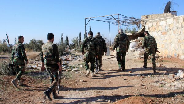 Syrian government forces inspect an area near the village of Khan Tuman, south from the provincial capital Aleppo, on December 22, 2015 - Sputnik International