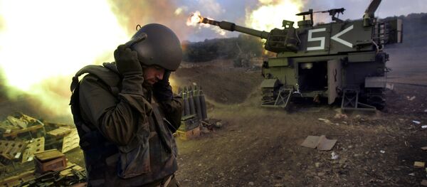 Israeli soldiers covers his ears as a mobile artillery unit fires shells into south Lebanon (File) Israeli soldiers covers his ears as a mobile artillery unit fires shells into south Lebanon (File) - Sputnik International