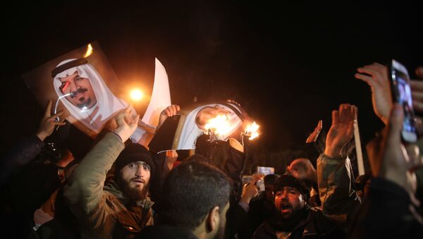 Iranian protesters gather outside the Saudi Embassy in Tehran during a demonstration against the execution of prominent Shiite Muslim cleric Nimr al-Nimr by Saudi authorities, on January 2, 2016 - Sputnik International
