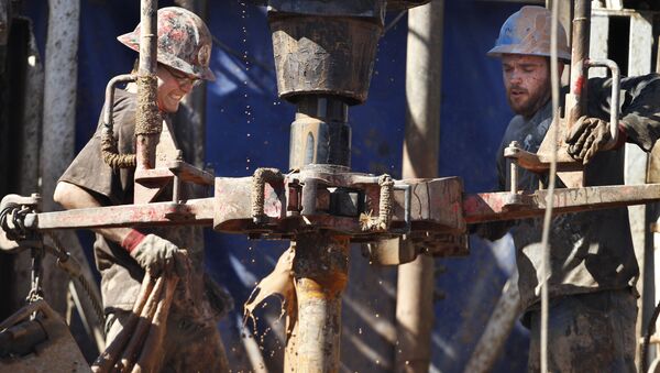 Oil field workers drill into the Gypsum Hills near Medicine Lodge, Kan. - Sputnik International